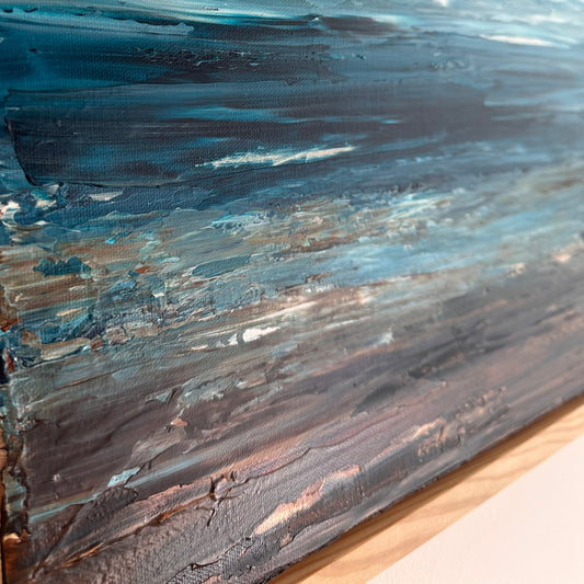 Close-up detail of Deep Blue Horizon showing layered blue, white and earthy tones and textured acrylic paint