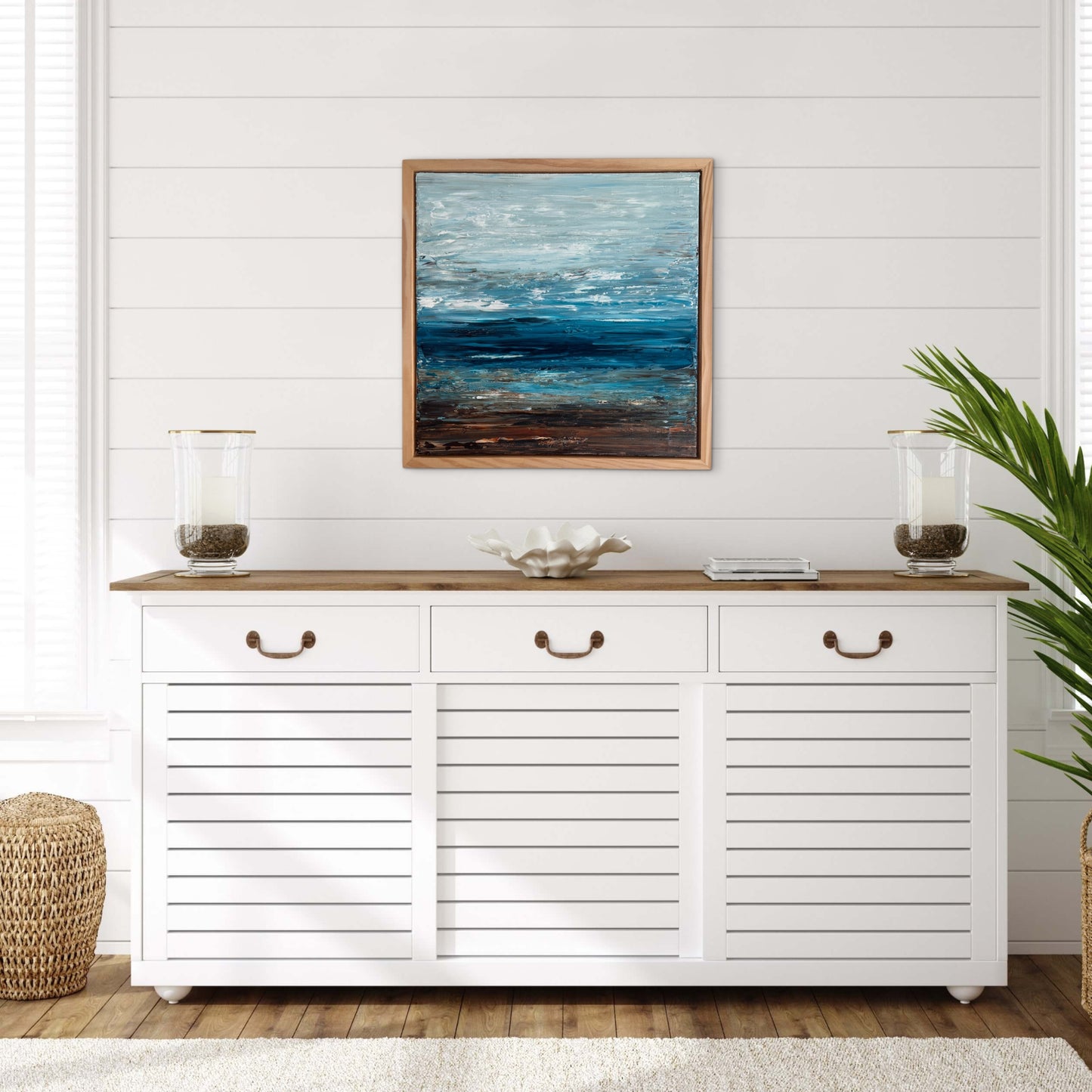 Deep Blue Horizon – Ocean & Earth VIII displayed above a white console in a light coastal interior