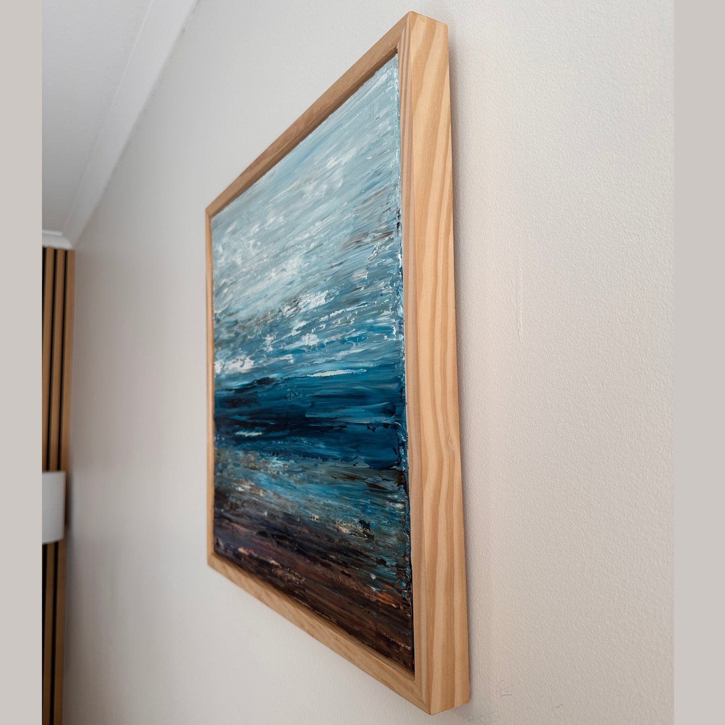 Side view of Deep Blue Horizon showing the framed artwork and depth of the canvas