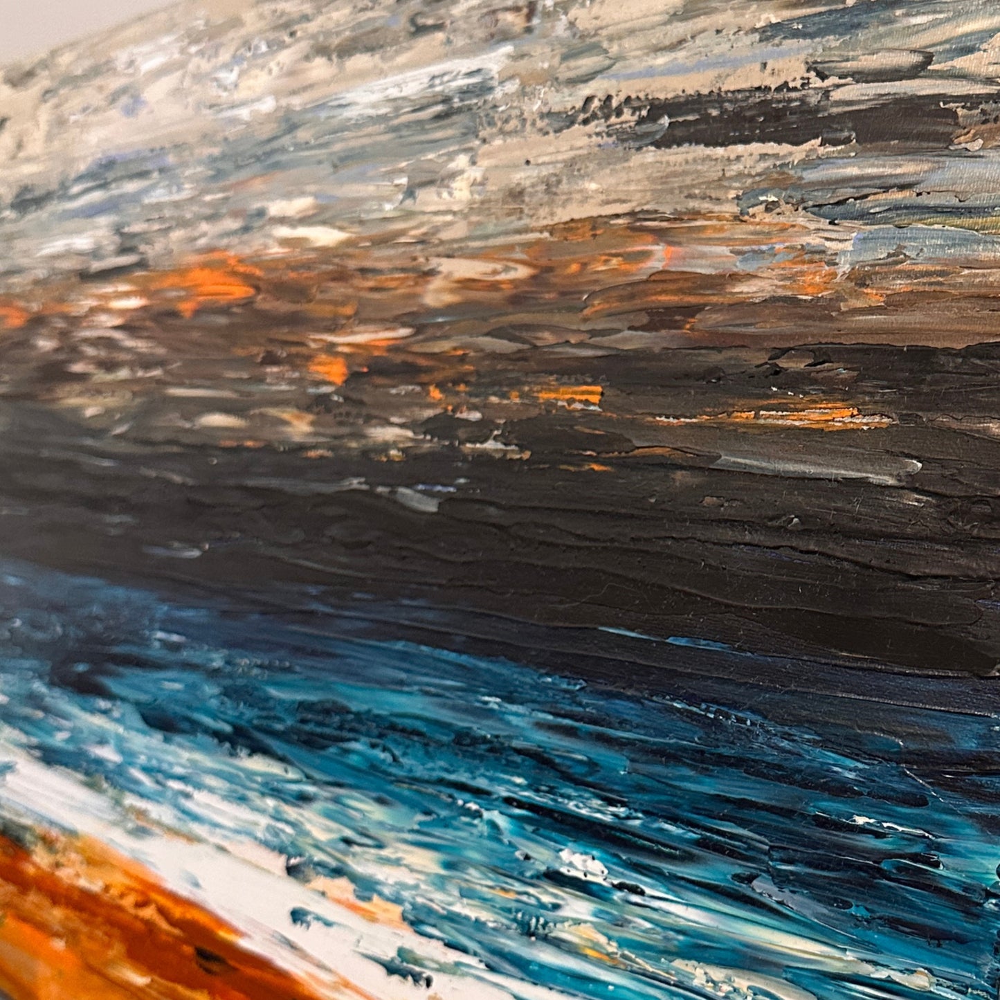 Close-up of Prussian Sea Sienna Sands III showing expressive layered coastal textures and rich blue and earth tones