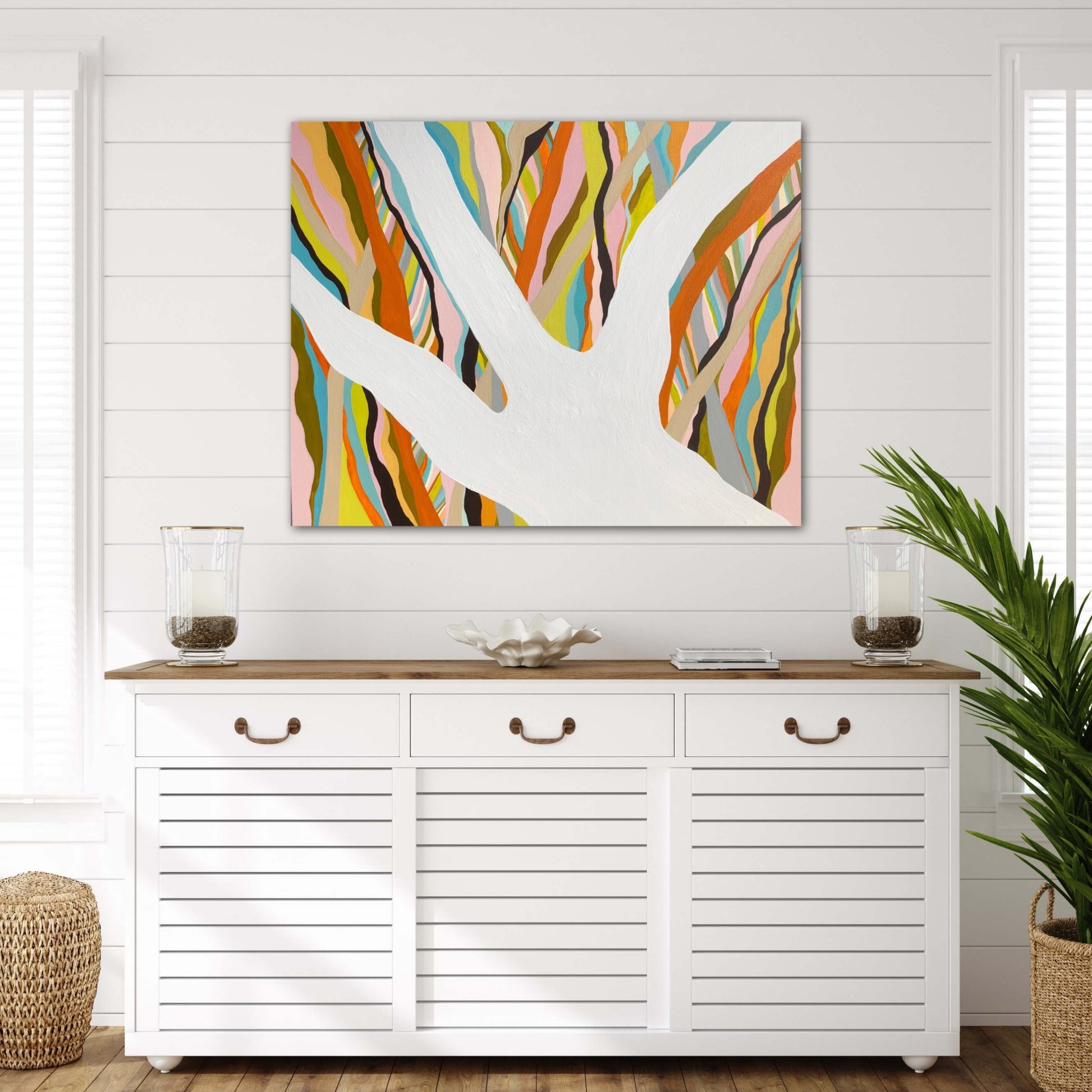 Brilliant Blue Gum original artwork displayed above a white console in a contemporary interior