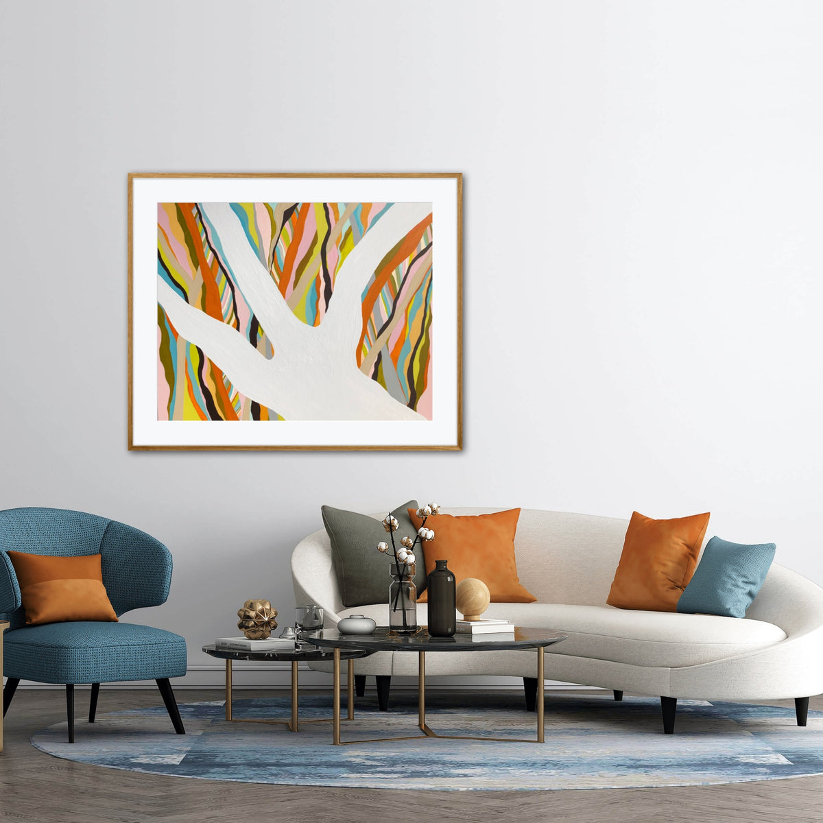 Brilliant Blue Gum framed print displayed in a living room with blue and orange throw cushions
