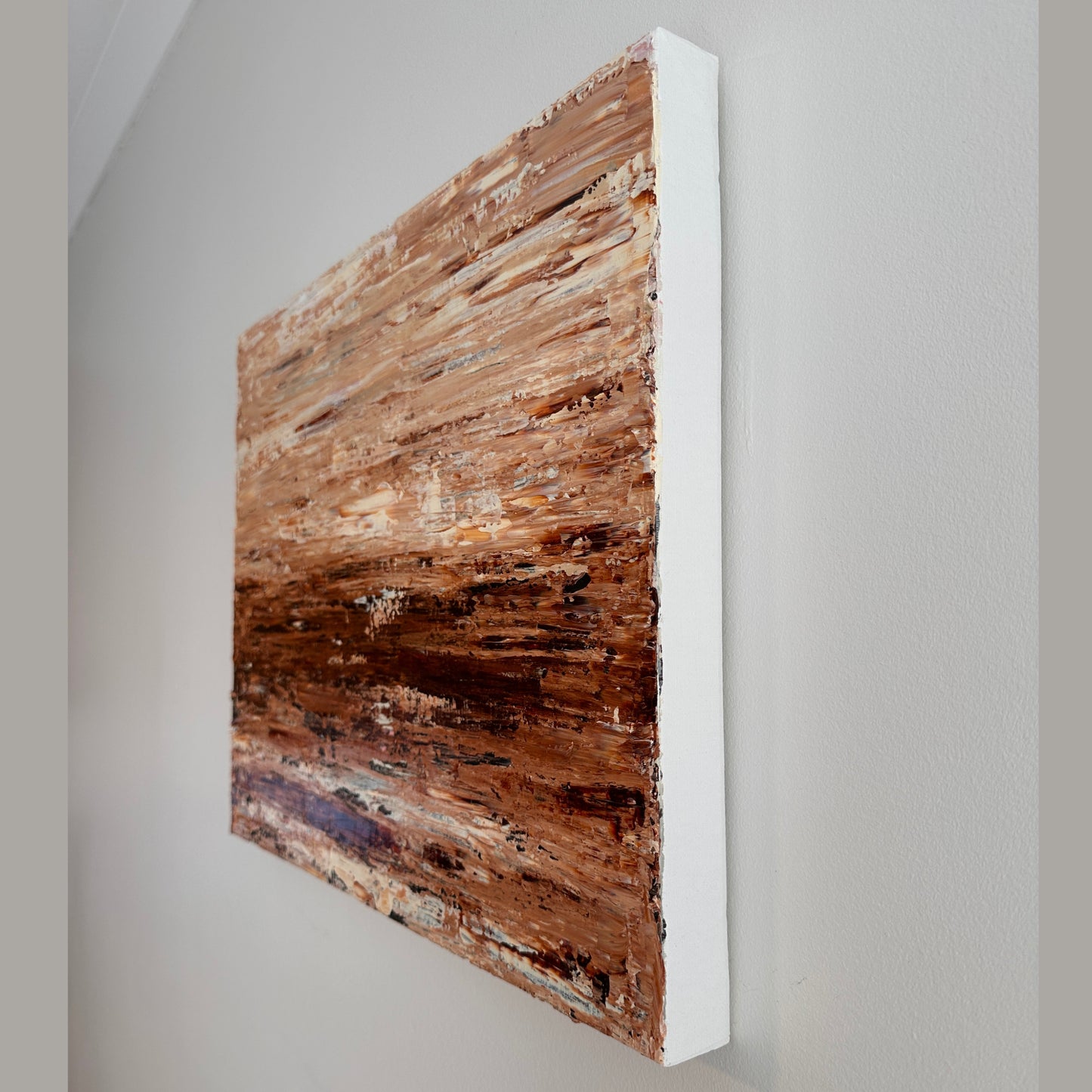Side view of Burnished Earth showing the depth and textured edge of the stretched canvas