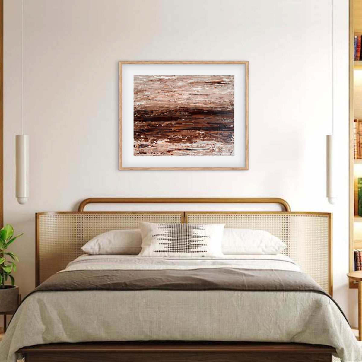 Ocean & Earth I framed print displayed above a bed with a cane headboard