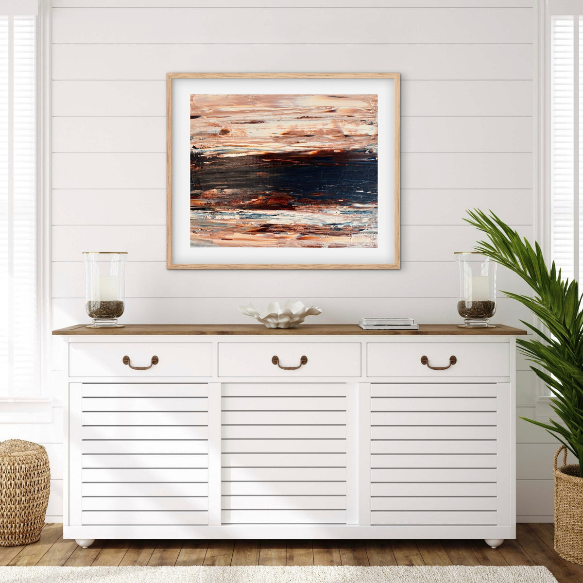 Ocean & Earth II framed print displayed above a console table in a coastal-style entryway