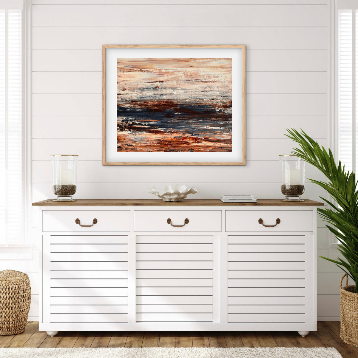 Ocean & Earth III framed print displayed above a console table in a coastal-style entryway