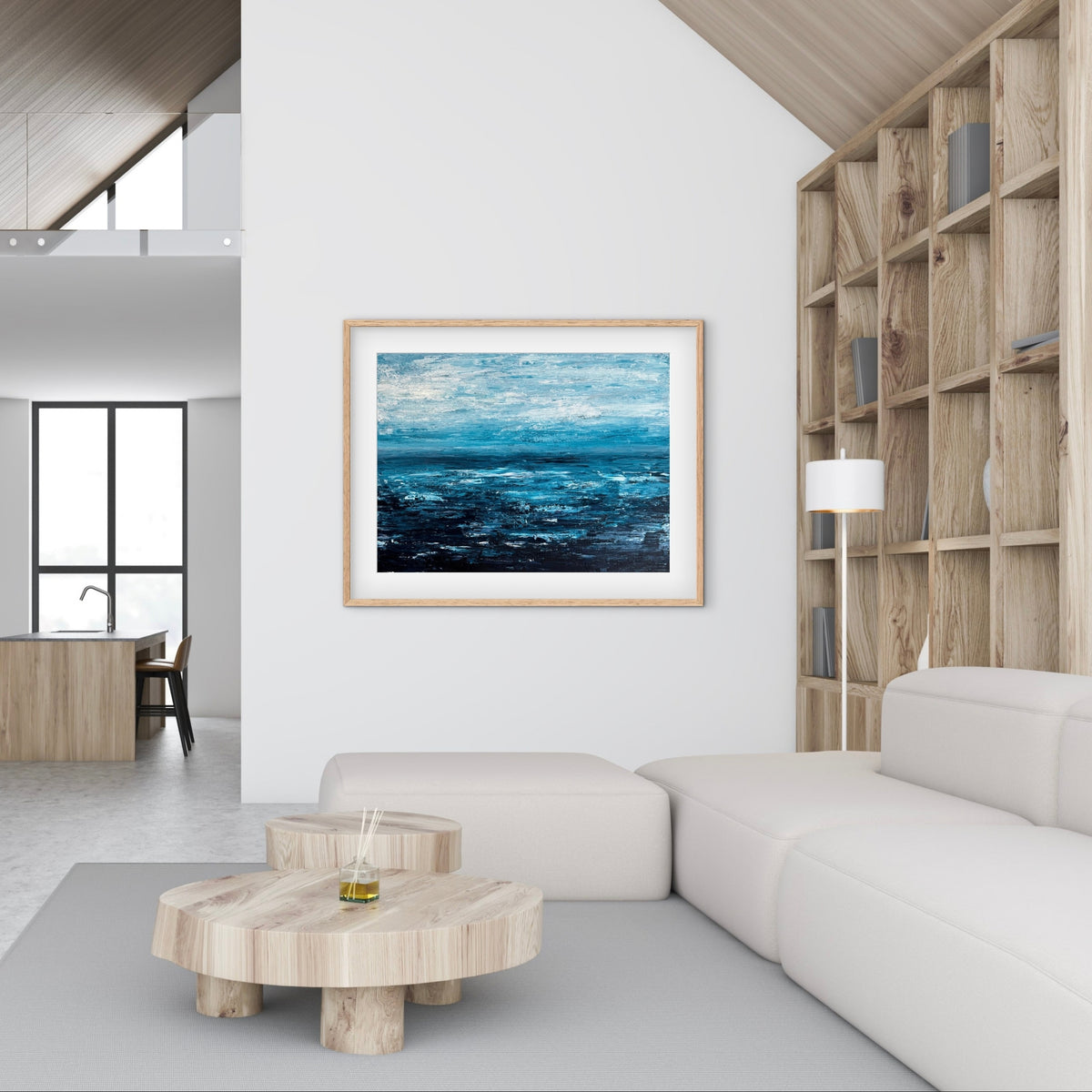 Quiet Tide framed print displayed in a neutral living room with a wood coffee table and plant
